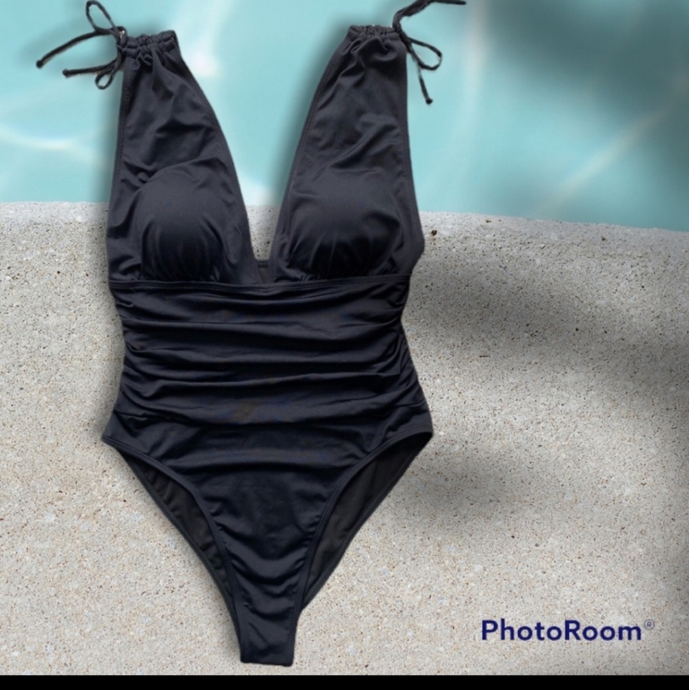NWOT Low Cut Roched Black Tank One Piece Swimsuit. New in manufacturing bag